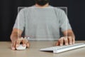 Man using mouse keyboard computer with virtual screen watch videos online streaming. Royalty Free Stock Photo