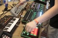 Man using music synthesizers