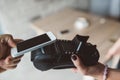 Man using NFC technology on smart phone to pay Royalty Free Stock Photo