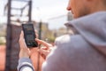 Man using online sports betting services on phone Royalty Free Stock Photo