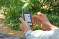 Man Using PDA / Smartphone Outside Royalty Free Stock Photo