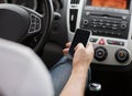 Man using phone while driving the car Royalty Free Stock Photo