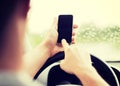 Man using phone while driving the car Royalty Free Stock Photo
