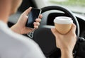 Man using phone while driving the car Royalty Free Stock Photo