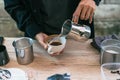 Man using Pitcher making latte coffee with equipment tool brewing table Royalty Free Stock Photo