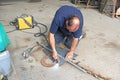 Man using a plasma cutter Royalty Free Stock Photo