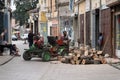 A man using a portable saw draws a small crowd of onlookers on the streets of Bitola, Macedonia