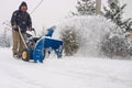 Man using a powerful snow blower Royalty Free Stock Photo