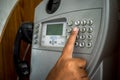 Man using public payphone Royalty Free Stock Photo