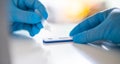 Man using a rapid antigen test kit. Rapid antigen testing is a screening tool to help to detect Corona COVID-19 in people without