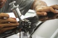 A man using repairing equipment to fix damaged windshield