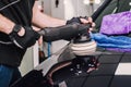 Man using a sander to polish a car& x27;s surface Royalty Free Stock Photo