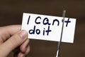 Man using scissors to remove the word can`t to read I can do it Royalty Free Stock Photo