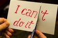Man using scissors to remove the word can`t to read I can do it Royalty Free Stock Photo