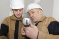 Man using silicone tube with apprentice Royalty Free Stock Photo