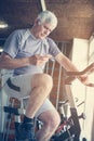 Man using smart phone in the gym. Man typing messages on Royalty Free Stock Photo