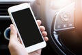 Man is using  smart phone mobile phone in car. Royalty Free Stock Photo