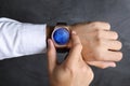 Man using smart watch to check time, closeup