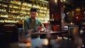 Man using smartphone bar. Bearded guy browsing cellphone screen sitting alone Royalty Free Stock Photo