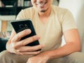 Man using smartphone in cafe.