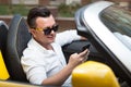Man using smartphone in car Royalty Free Stock Photo