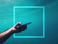 Man using smartphone device underwater in deep blue sea with trendy frame copy space during summer holiday vacation Royalty Free Stock Photo