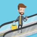 Man using smartphone on escalator in airport. Royalty Free Stock Photo