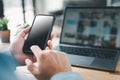 Man using smartphone. Mobile phone screen mockup. cell phone blank screen for hand typing text, using laptop contact business Royalty Free Stock Photo