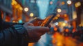 A Man Using a Smartphone at Night in a City Royalty Free Stock Photo