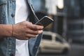 Man using smartphone on street Royalty Free Stock Photo