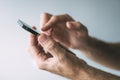 Man using smartphone to type text message Royalty Free Stock Photo