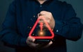 Man using smartphone with warning sign.Notification error and virus detection spyware. Royalty Free Stock Photo