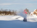 Man using snow blower on snowy drive Royalty Free Stock Photo