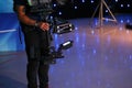 Man using a steadicam in a television studio Royalty Free Stock Photo