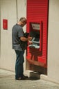 Man using a street cash machine at Merida Royalty Free Stock Photo