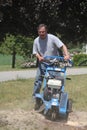 Man using stump grinder Royalty Free Stock Photo