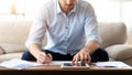 Man using tablet at home and writing notes Royalty Free Stock Photo