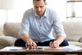Man using tablet at home and writing notes Royalty Free Stock Photo