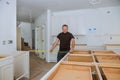 0Man using tape measure for measuring on kitchen in for home improvement Royalty Free Stock Photo