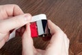 Man using teflon tape to seal water ball faucet with red valve. Wrap PTFE tape on valve thread. Brass water tap close up Royalty Free Stock Photo