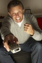 Man Using Television Remote Control