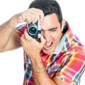 Man using a vintage looking compact camera Royalty Free Stock Photo