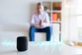 Man using virtual assistant, smart speaker at home Royalty Free Stock Photo