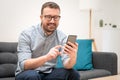 Man using virtual assistant and texting on mobile phone Royalty Free Stock Photo