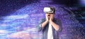 Man using virtual reality headset and getting in simulated futuristic world, banner