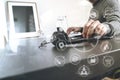 Man using VOIP headset with latop computer on desk in modern off Royalty Free Stock Photo