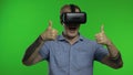 Man using VR headset helmet to play game. Watching virtual reality 3d 360 video. Chroma key Royalty Free Stock Photo