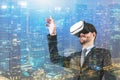 Man using VR headset in night city Royalty Free Stock Photo