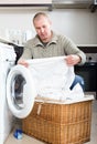 Man using washing machine Royalty Free Stock Photo