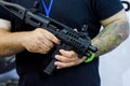 Kyiv, Ukraine - October 10, 2018: Man using weapon. International Exhibition ARMS AND SECURITY 2018